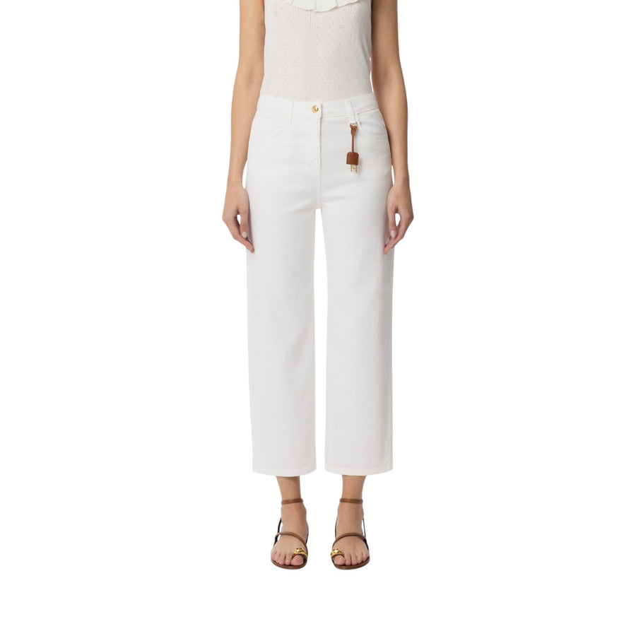 Jeans donna  in cotone tinto con charm logato