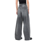 Jeans donna baggy con borchie