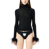 Maglia donna in lana a coste con piume