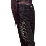 Jeans donna con applicazioni