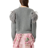 Maglia donna in lana a coste con piume