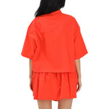 Camicia donna cropped con dettagli metallici