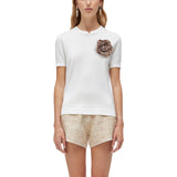 Maglia donna in lyocell e cotone con spilla floreale