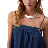 Top donna in denim con castoni