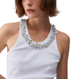 Top donna con dettagli gioiello