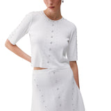 Top donna in maglia con borchie