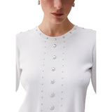 Top donna in maglia con borchie