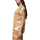 Blusa donna asimmetrica in raso stampato