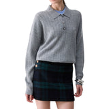 Polo donna in maglia con bottoni gioiello