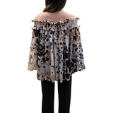 Blusa donna con scollo a barca elasticizzato
