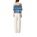 Top donna in denim con volant e spalle scoperte