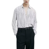 Camicia uomo fluida con stampa grafica in viscosa