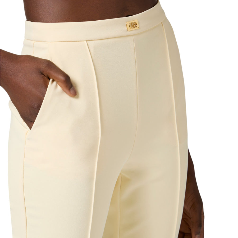 Pantaloni donna  in crêpe con tasche e placca logo