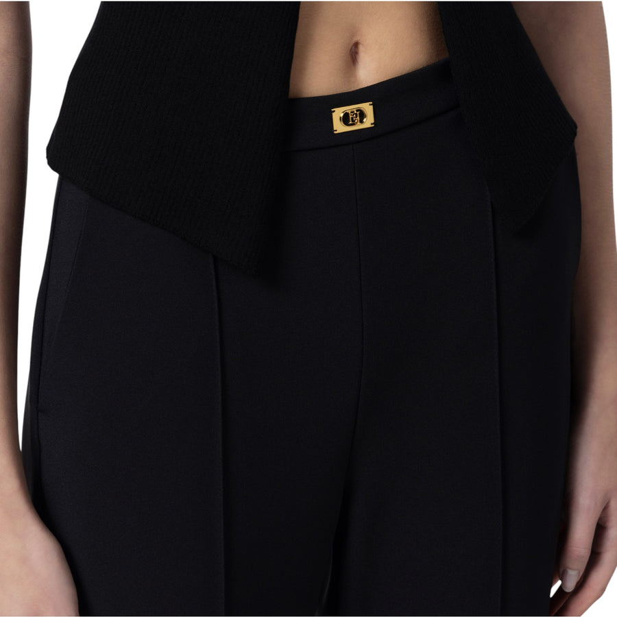 Pantaloni donna  in crêpe con tasche e placca logo