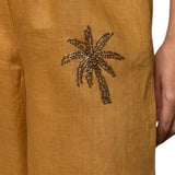 Pantaloni donna a palazzo in lino con elastico e ricamo palme