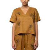 Blusa donna in lino con scollo a v e ricamo palme